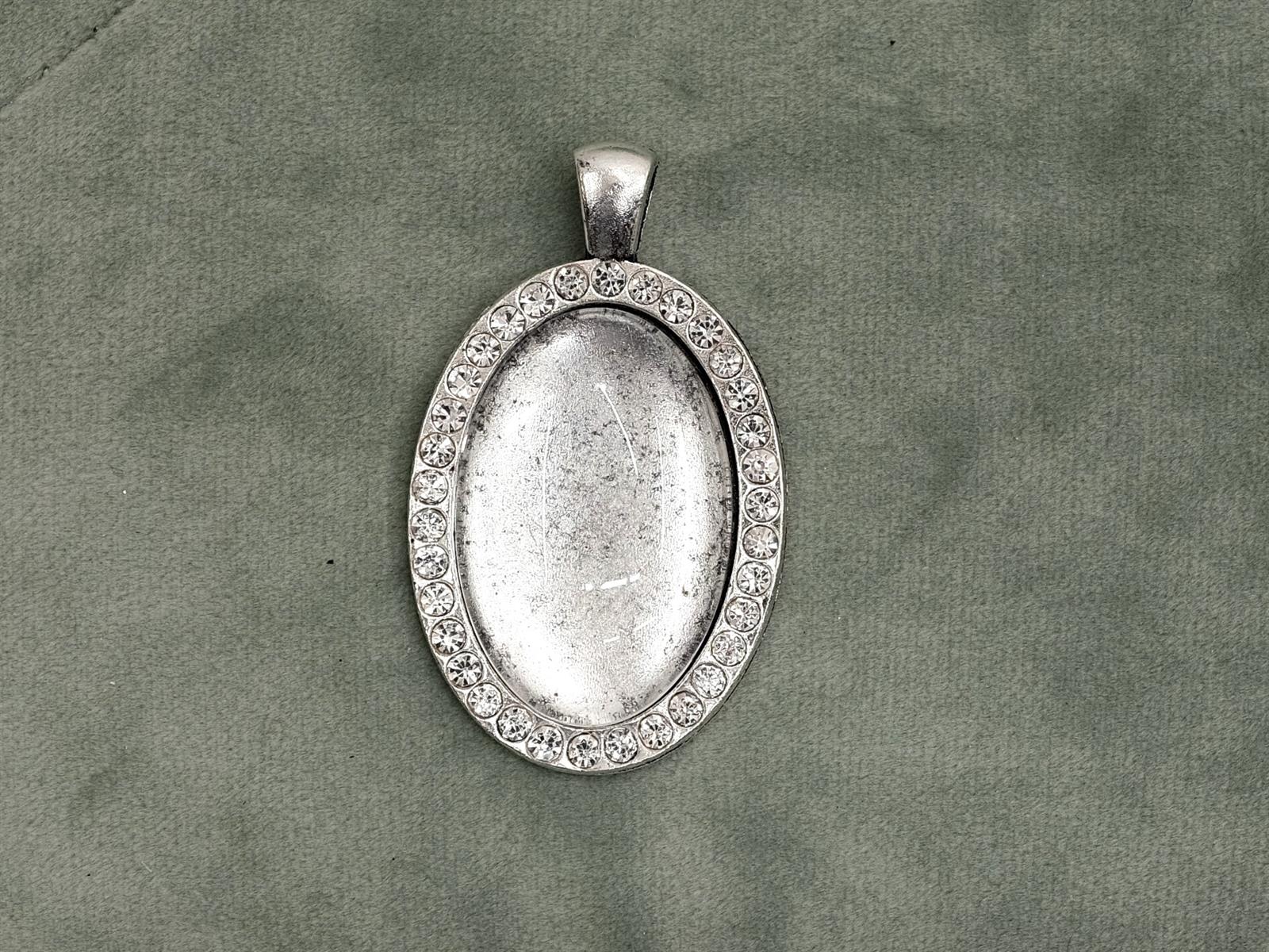 Glascabochon oval, silber, Rahmen m. Strass außen